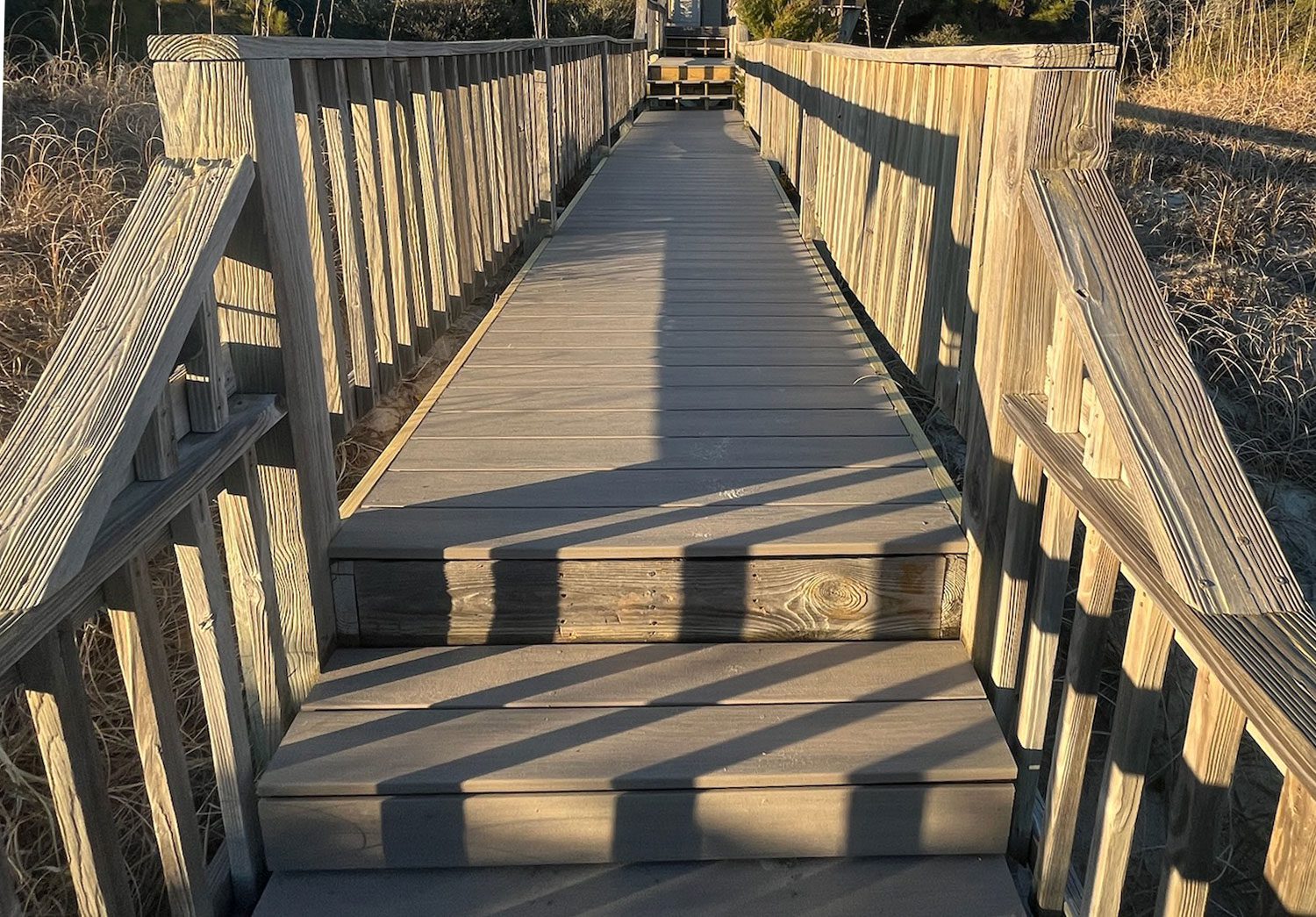 boardwalk and stairs leading to beach house